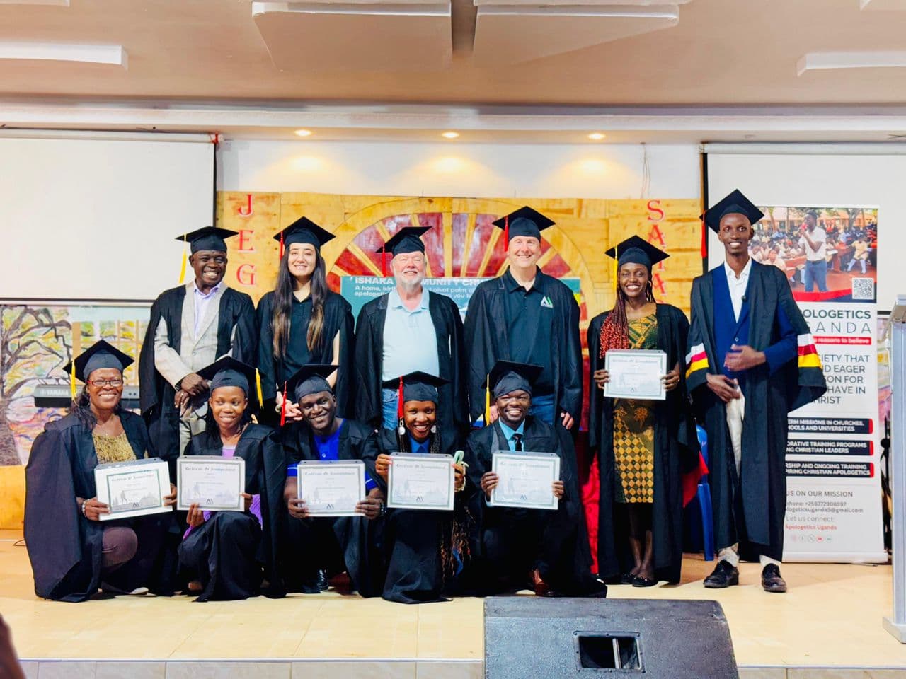 Graduates holding certificates